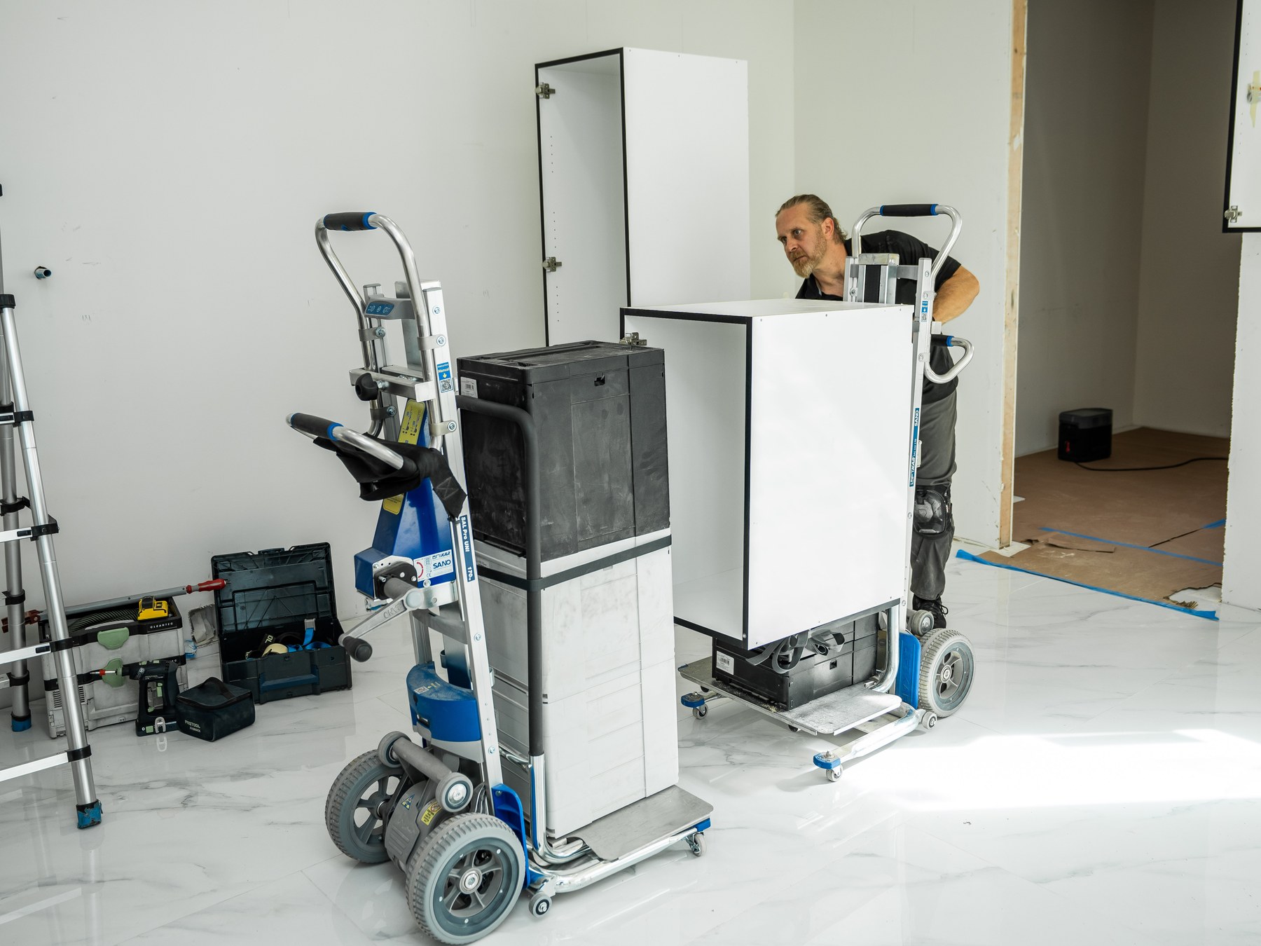 Tall pantry cabinet loaded on a LiftKar Cabinet Pro in a new kitchen