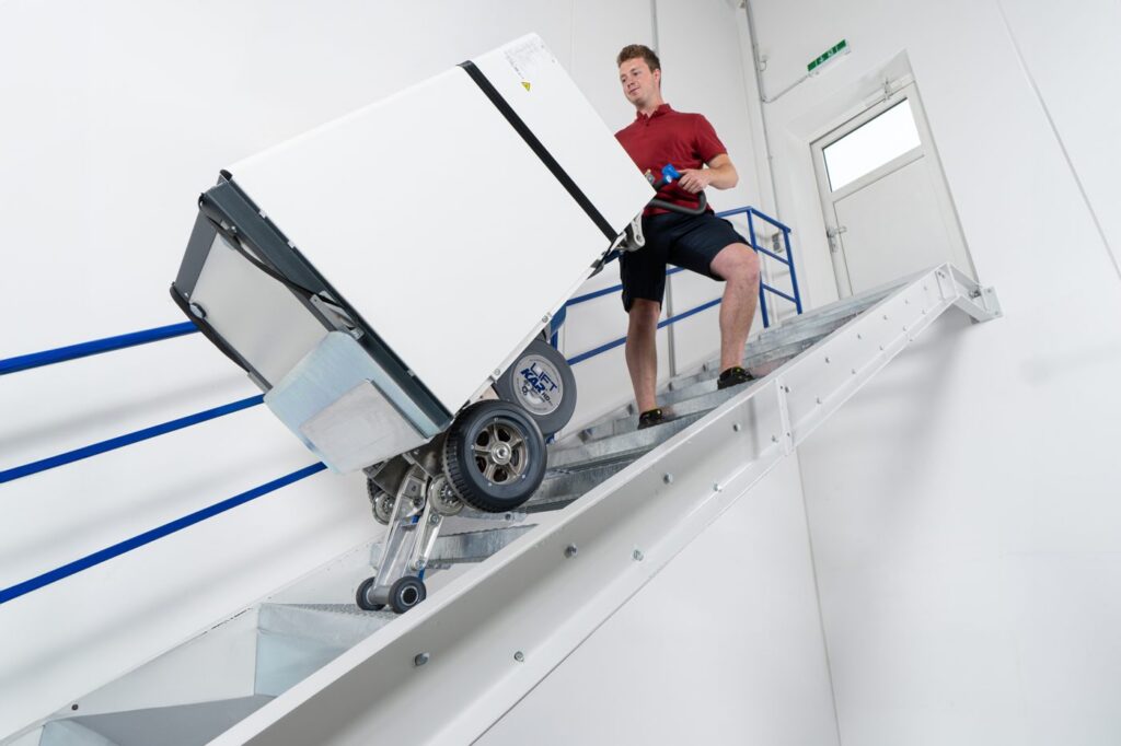 LiftKar HD Pro taking a refrigerator up a staircase