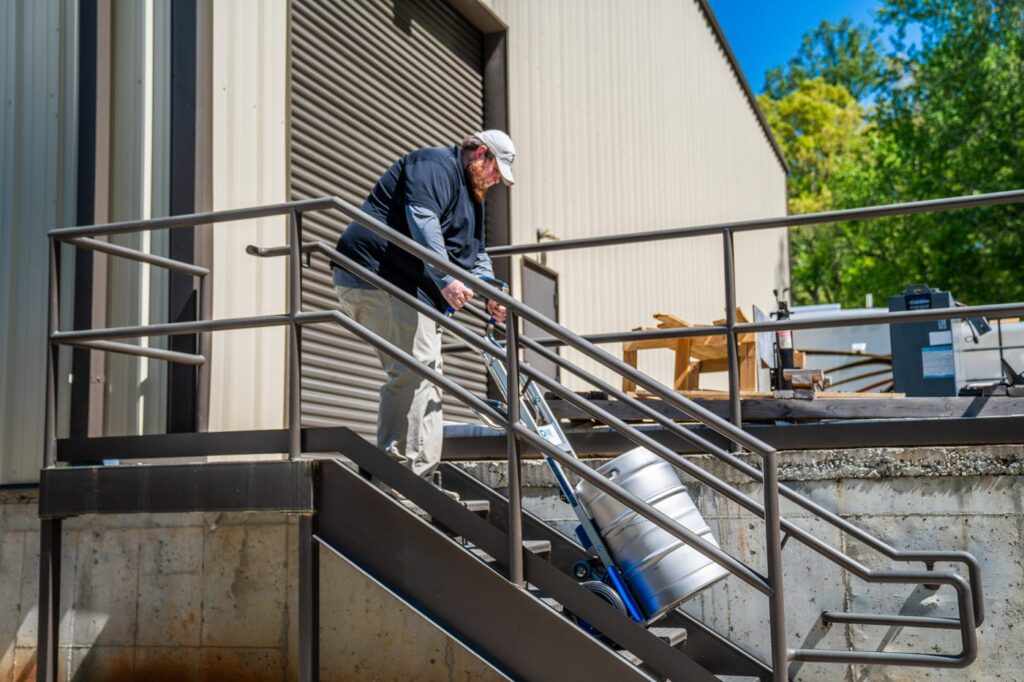 KegKar STOUT taking a keg down loading-dock stairs