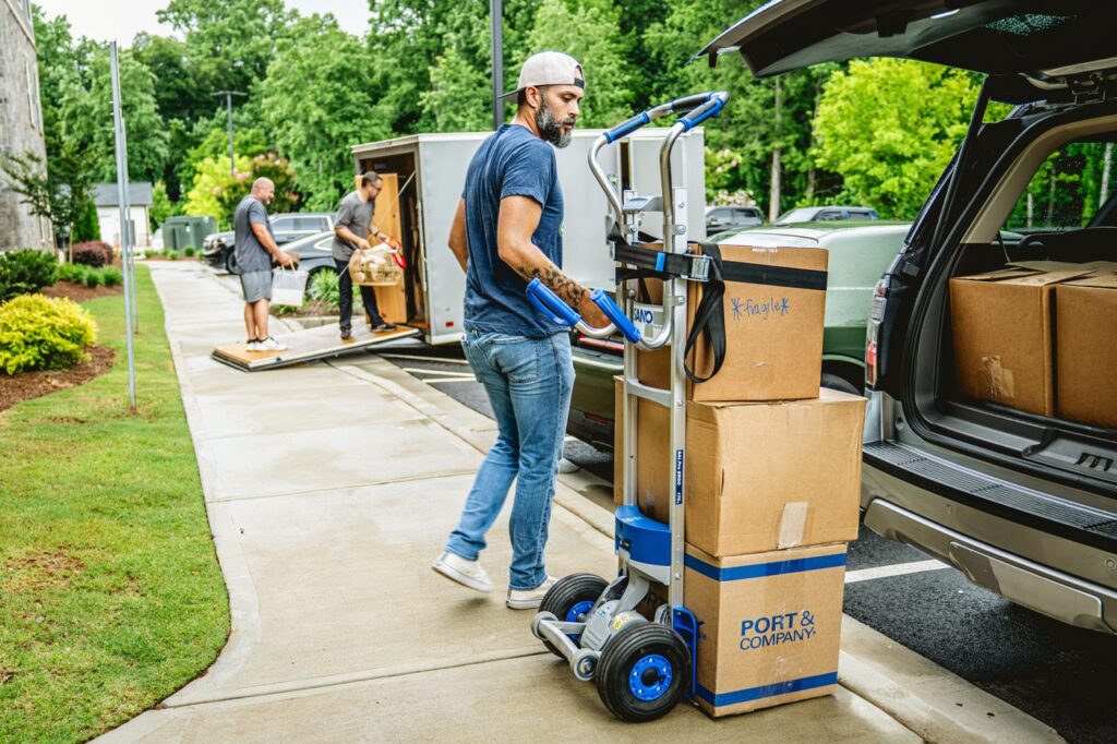 LiftKar SAL Pro loading boxes at an SUV tailgate